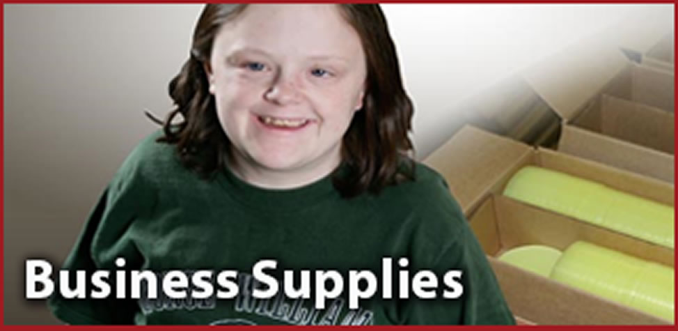 A young woman smiles in front of a box of office supplies. Title - Business Supplies 